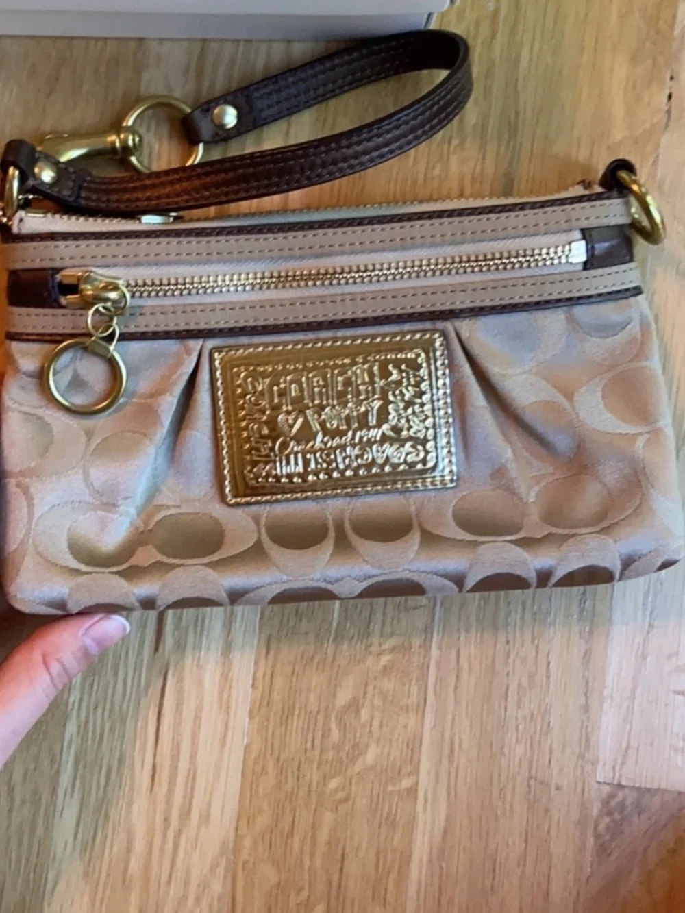 Coach Beige Signature Wristlet Pouch with Gold Logo Plaque